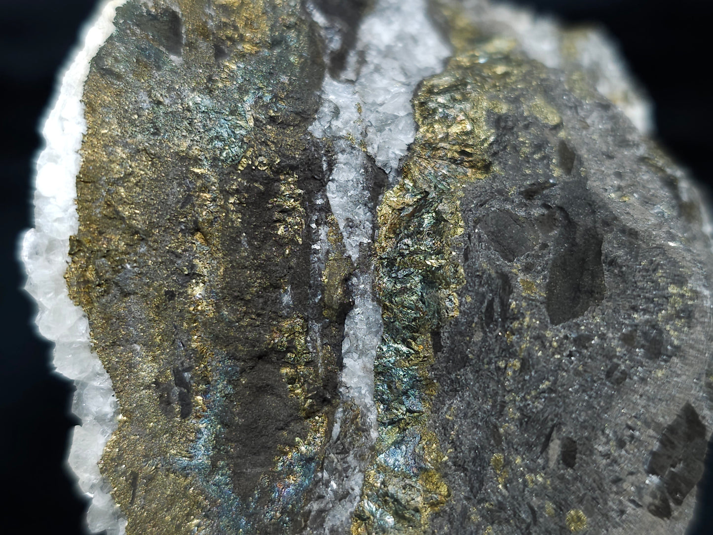 #66130 Hydrothermal iridescent golden and peacock Chalcopyrite ore deposit with hydrothermal Calcite deposit with Marcasite on multiple small fossils