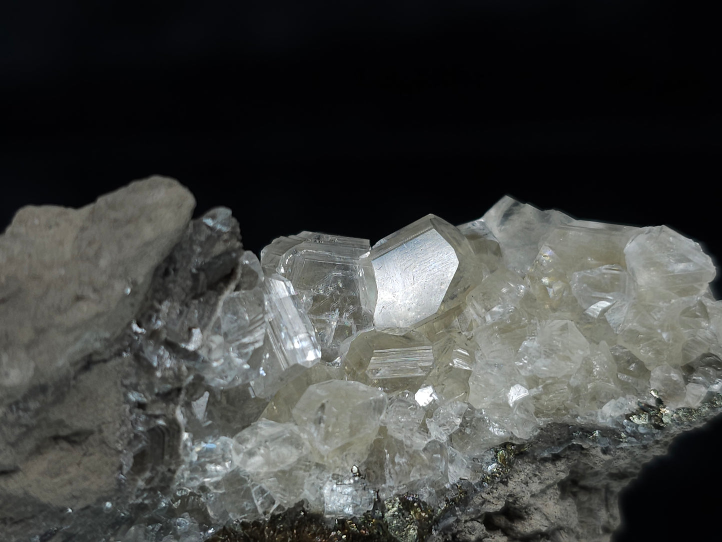 #33652-A Super clear Nailhead Spar Calcite tiny cluster and Chalcopyrite ore and multiple small fossils in the matrix
