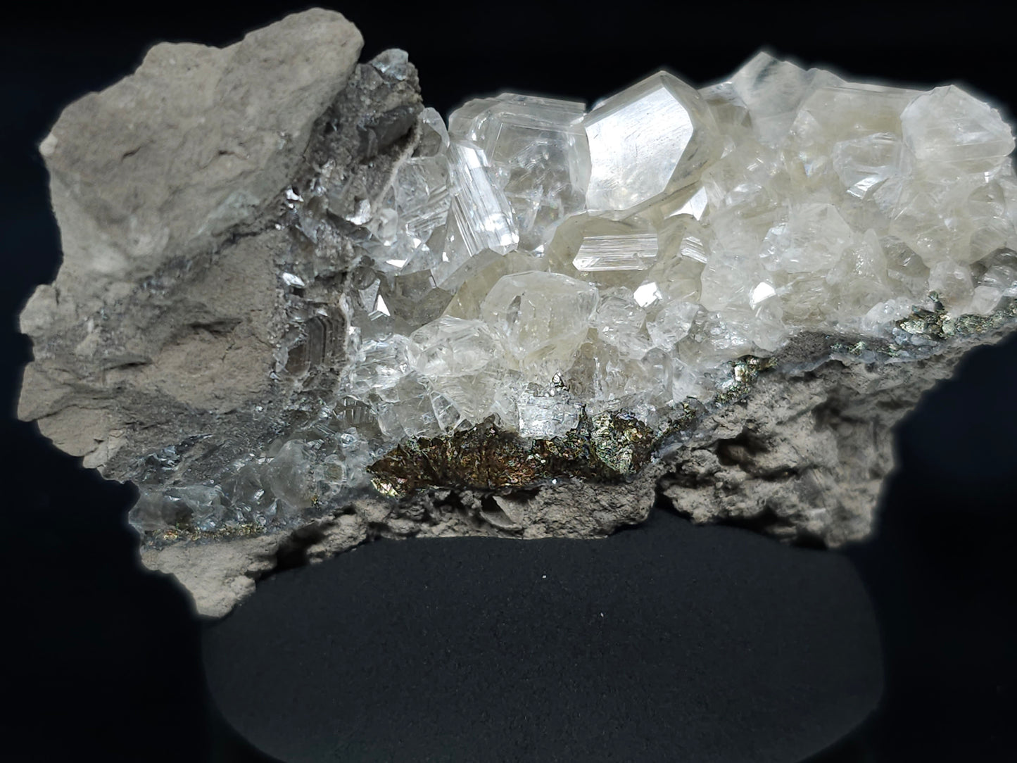 #33652-A Super clear Nailhead Spar Calcite tiny cluster and Chalcopyrite ore and multiple small fossils in the matrix