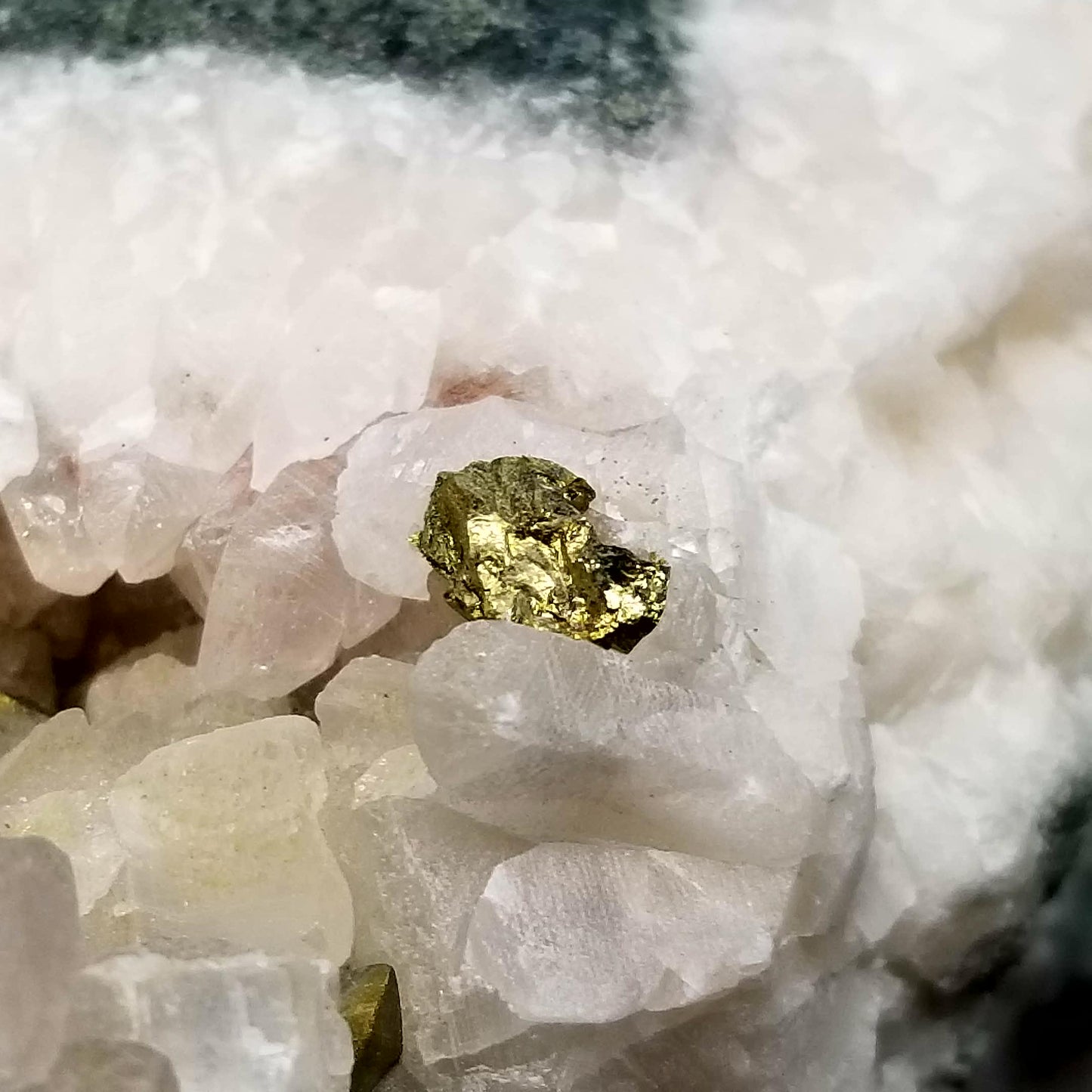 #11083 Iridescent Gold Chalcopyrite on clear Combined form Calcite with Hematite inclusions