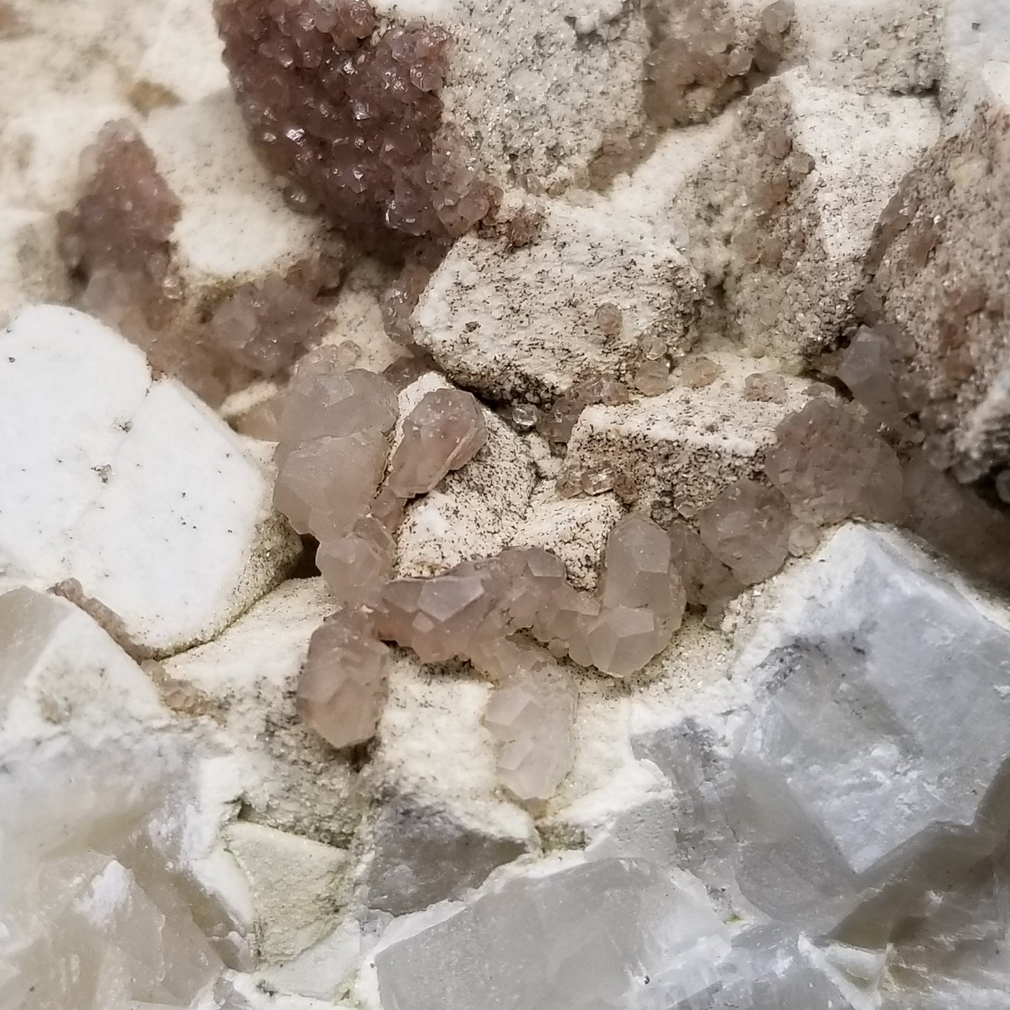 #11114 white Dolomite and small water clear Nailhead Spar Calcite crystals with Hematite inclusions on Combined form Calcite cluster on white Calcite