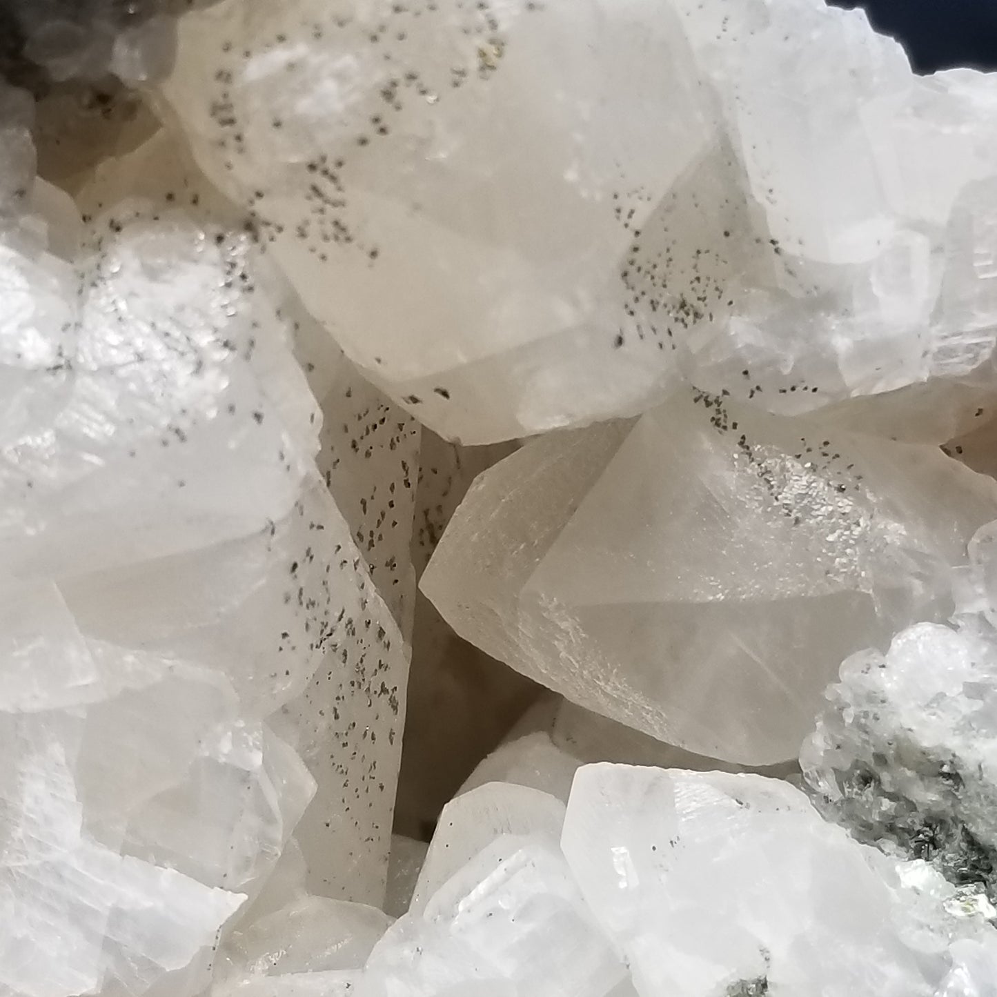 #11201 Chalcopyrite dust on white and clear Combined form Calcite on matrix