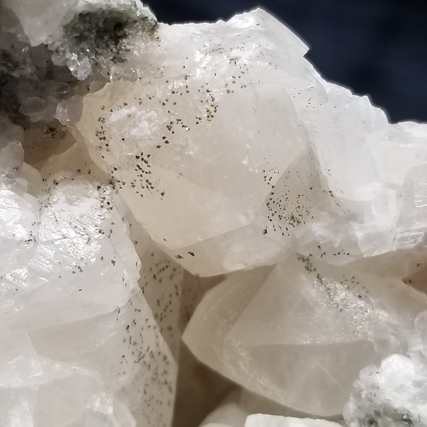 #11201 Chalcopyrite dust on white and clear Combined form Calcite on matrix