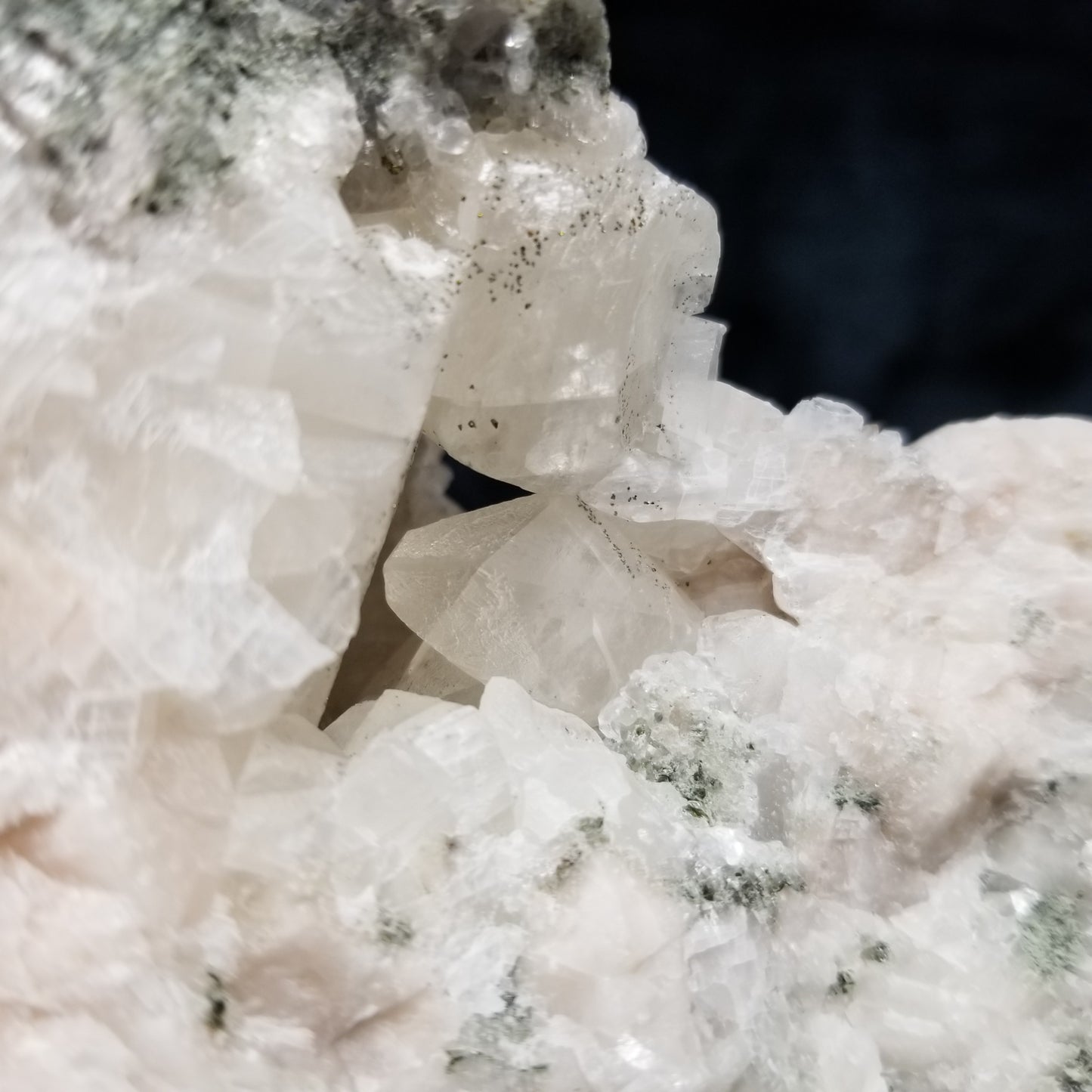 #11201 Chalcopyrite dust on white and clear Combined form Calcite on matrix