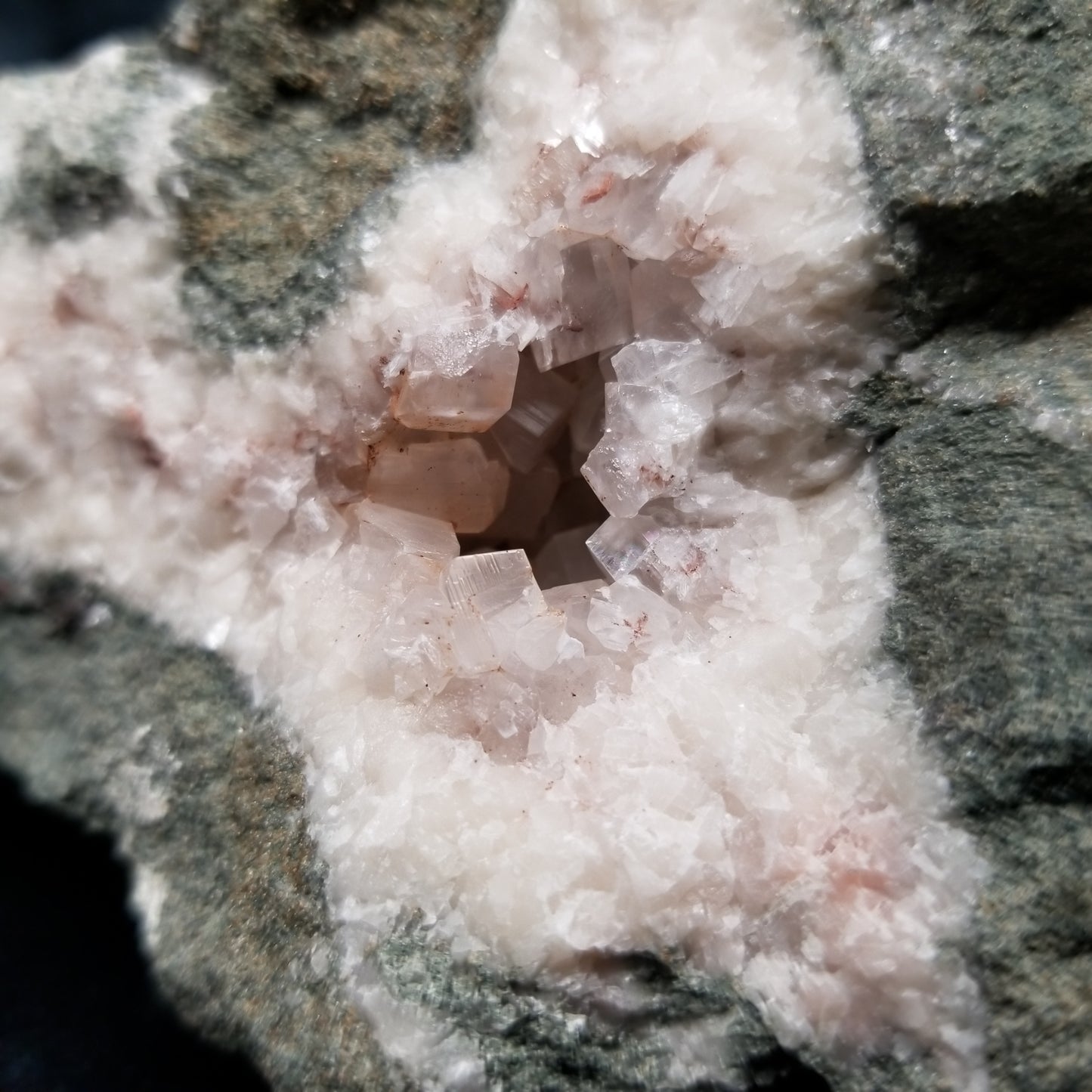 #11286 Chalcopyrite on clear Combined form Calcite with Hematite inclusions